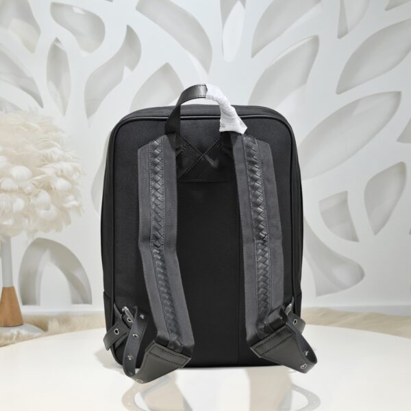 Bottega Veneta's classic Intrecciato woven men's backpack (fabric and leather combination).