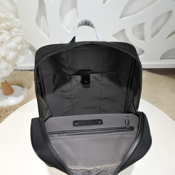 Bottega Veneta's classic Intrecciato woven men's backpack (fabric and leather combination).