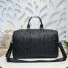Bottega Veneta's classic Intrecciato woven men's travel bag (black calfskin).