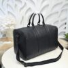 Bottega Veneta's classic Intrecciato woven men's travel bag (black calfskin).