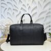 Bottega Veneta's classic Intrecciato woven men's travel bag (black calfskin).