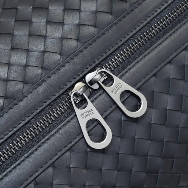 Bottega Veneta's classic Intrecciato woven men's travel bag (black calfskin).