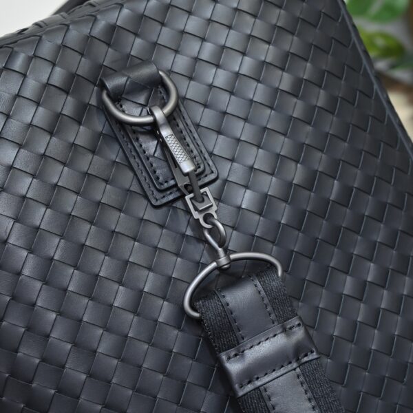 Bottega Veneta's classic Intrecciato woven men's travel bag (black calfskin).
