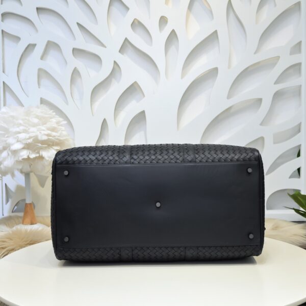 Bottega Veneta's classic Intrecciato woven men's travel bag (black calfskin).