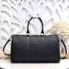Bottega Veneta's classic Intrecciato woven men's travel bag set (black calfskin).
