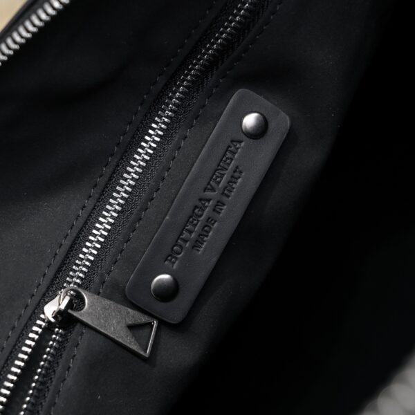 Bottega Veneta's classic Intrecciato woven men's travel bag set (black calfskin).