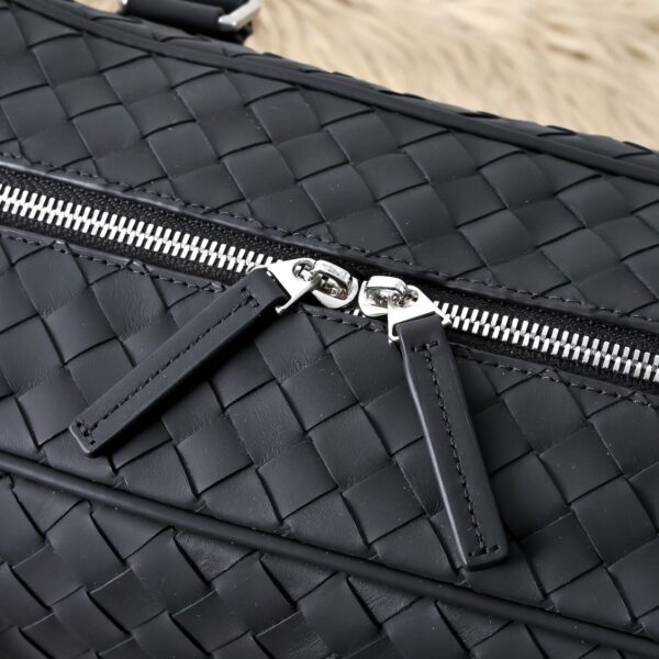 Bottega Veneta's classic Intrecciato woven men's travel bag (black calfskin).